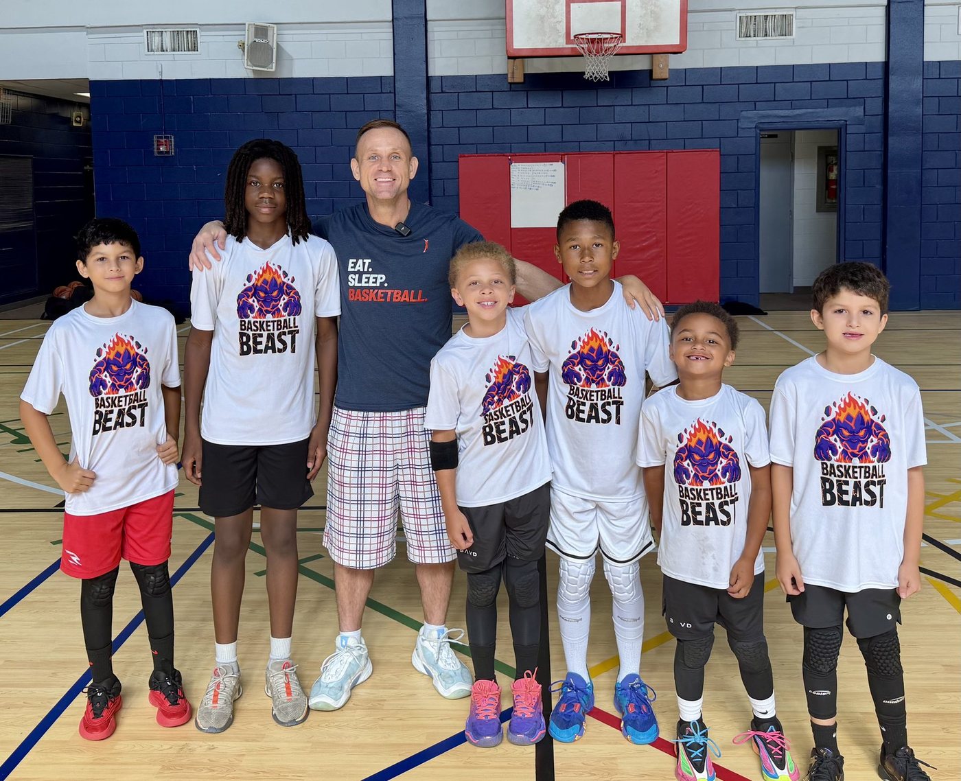 Coach Teddy Dupay with a group of young players in his Tampa gym